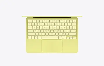 Apple MacBook Neo 2026 Citrus — top-down view of the full Magic Keyboard and mechanical Multi-Touch trackpad